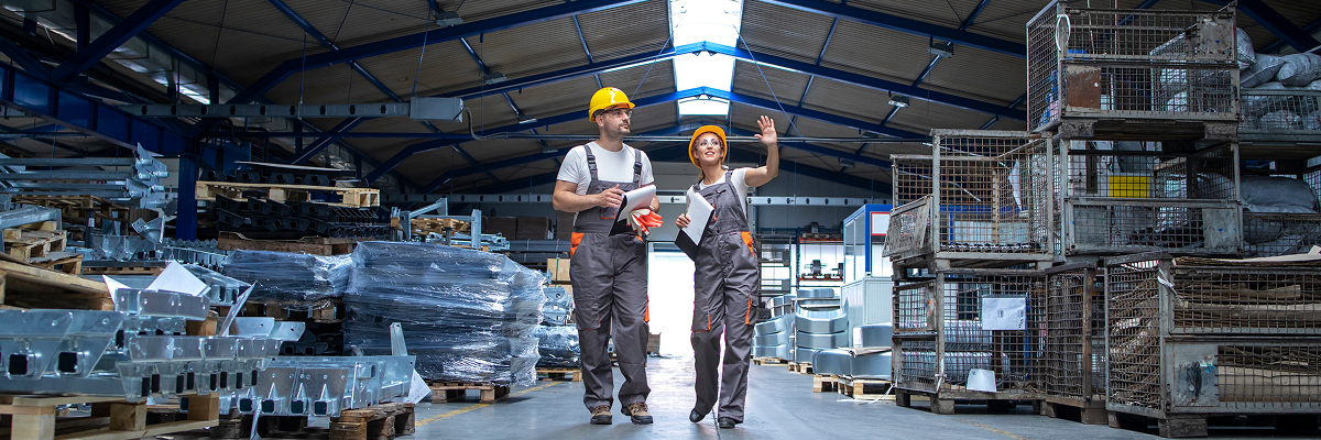 factory-workers-walking-through-large-production-hall 1 (1)